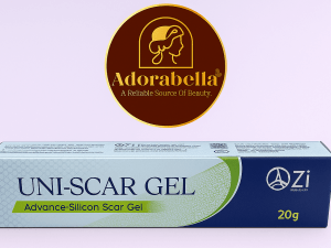 Uni-Scar Gel 20gm tube and box on white table with Adorabella logo and green natural background