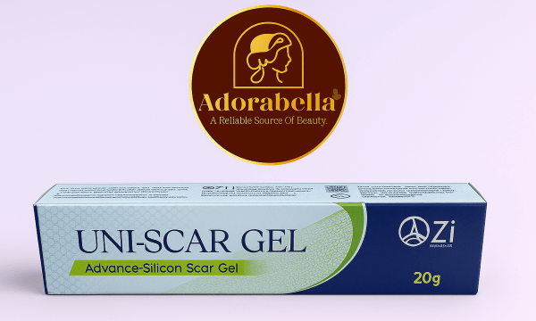 Uni-Scar Gel 20gm tube and box on white table with Adorabella logo and green natural background