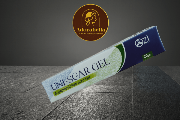 Uni-Scar Gel 20gm tube and box on white table with Adorabella logo and green natural background