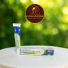 Uni-Scar Gel 20gm tube and box on white table with Adorabella logo and green natural background